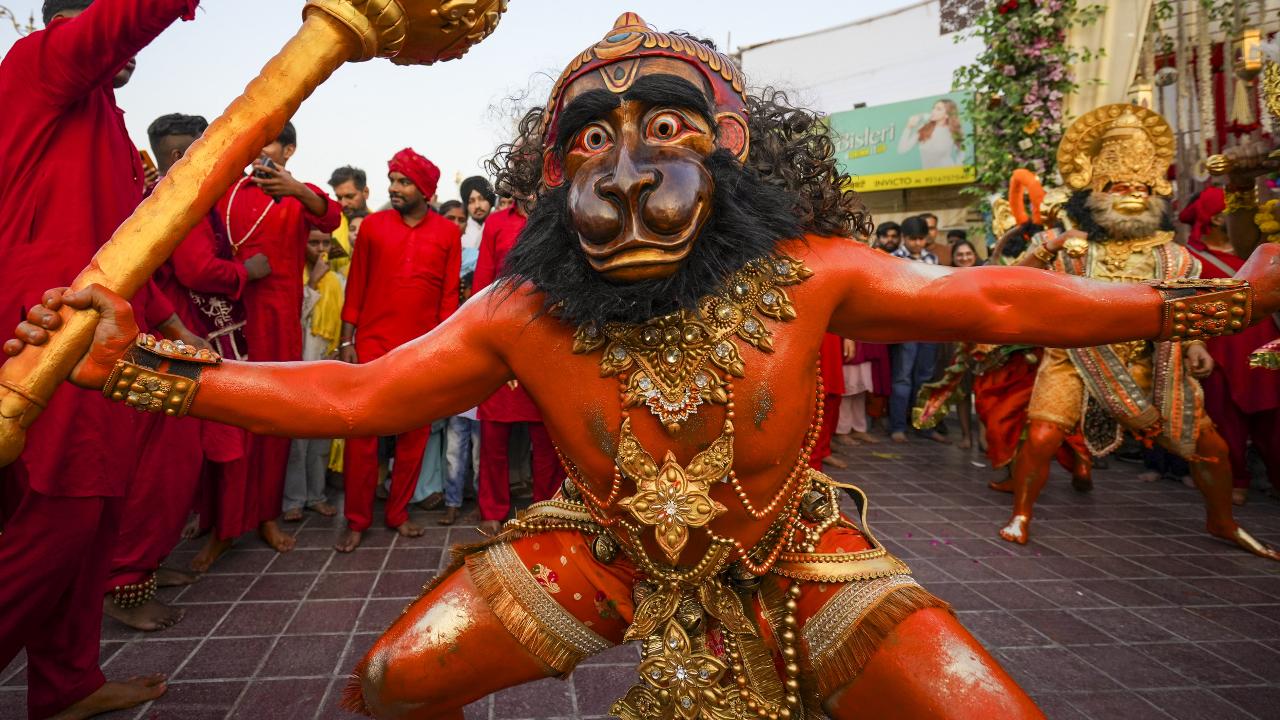 A devotee dressed as Lord Hanuman takes part in a religious procession during the 'Navratri' and 'Langur Mela' celebrations, at Durgiana Temple, Amritsar, Tuesday, Sept. 23, 2025. Photo Courtesy: PTI